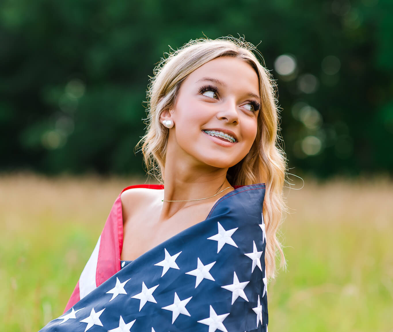 happy patient with braces outdoors