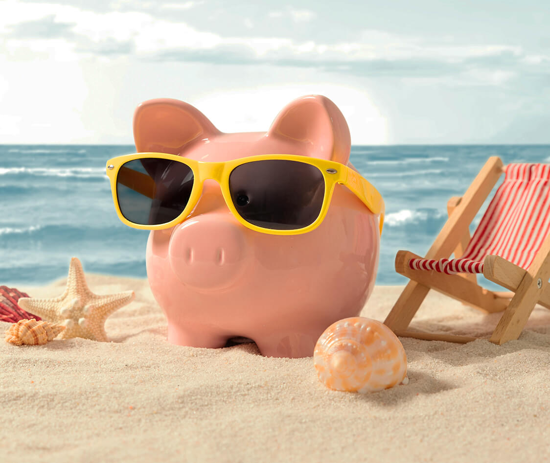 Piggy bank on vacation. Finance and travel concept